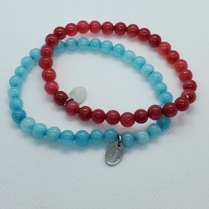 Red and Blue Jade stretch bracelets.